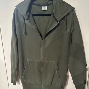 Gymshark Crest Zip up Hoodie in the color Core Olive. Brand New w/o tags